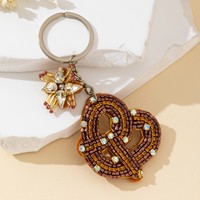 Porte-clés de sac punk marron, bijoux de mode géométriques, nœuds géométriques tendance pour sacs à dos et sacs d'école