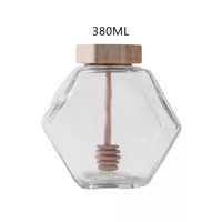 Best-seller pot à miel en verre pot à miel unique avec louche en bois pot hexagonal en verre pour miel 100ml 220ml 380ml en stock