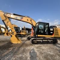 Excavatrice hydraulique CAT 320E d'occasion, fonctionnement fluide, largement utilisée dans la rénovation urbaine et l'aménagement paysager