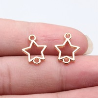 Conector de 2 bucles con contorno de estrella hueca, 15x12mm, de aleación de plata antigua, para cadena de collar en capas