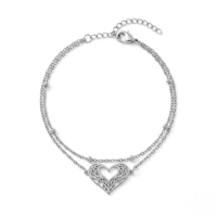 QIAOREN 11944 Bracelet tendance en filigrane en forme de cœur superposé, en acier inoxydable plaqué or 18 carats, avec chaîne satellite et motif cœur ajouré, bijoux