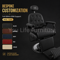 Fauteuil de barbier rembourré noir avec appui-tête, repose-pieds en métal, repose-pieds large et base ronde pour salon de coiffure professionnel