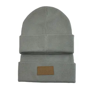 China Warm Gorras Wholesale Knitted Winter Cap 100% Acrylic Bennie Hats Knitted Beanie Hat With Leather Patch Logo