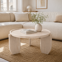 Table basse surélevée en oxyde de magnésium aspect travertin avec plateau rond et support à 3 points pour salon et décoration intérieure
