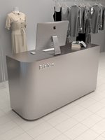 Comptoir de réception minimaliste en MDF argenté brossé pour magasin de vêtements, boutique de prêt-à-porter féminin, petit bureau de réception oblong