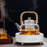 Théière en verre résistant aux hautes températures avec poignée, design moderne et minimaliste, pour la préparation du thé à la maison, compatible avec les plaques électriques en céramique