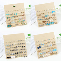 Ensemble de boucles d'oreilles tendance, design fleur, étoile de mer, papillon, en alliage, clous et pendantes, pour femmes, bijoux de luxe léger, vente en gros