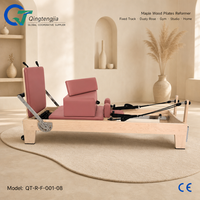 Appareil de Pilates Reformer en bois d'érable à rail fixe avec revêtement rose poudré pour studio de boutique