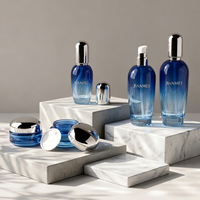 Ensemble de pots à crème pour le visage et flacons de lotion en verre bleu dégradé avec bouchon argenté pour l'emballage cosmétique