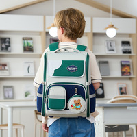Nouveaux sacs à dos de style britannique, grande capacité, respirants, imperméables, en polyester, à motifs géométriques, avec sangles à coussin d'air, vente en gros