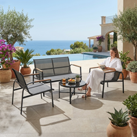 Ensemble de salon de jardin moderne 4 pièces en acier avec sièges en maille respirante et accoudoirs imitation bois pour l'extérieur