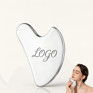 Outil de massage facial Gua Sha en acier inoxydable avec logo personnalisé, pour raffermir <span class=keywords><strong>la</strong></span> peau et lifter le visage, forme cœur personnalisée - Product Image 1