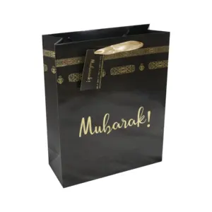 เครื่องใช้บนโต๊ะอาหารแบบฟอยล์สีทองแบบใช้แล้วทิ้งแผ่นกระดาษสำหรับใส่ผ้าเช็ดปากสีดำ umrah Mubarak