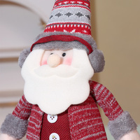 Poupée elfe rayée de Noël avec chapeau et bottes de Père Noël - Jouet amusant et décoration pour la maison.