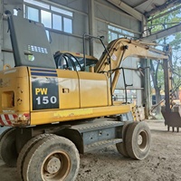 Excavatrice sur pneus Komatsu PW150-7 d'occasion, 15 tonnes, haute performance, engin de construction avec boîte de vitesses et pompe, prix avantageux