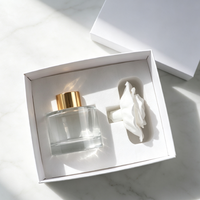Diffuseur de parfum d'ambiance de luxe 100 ml en verre avec bâtonnets et pierre aromatique en céramique parfumée en forme de fleur
