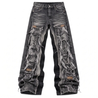 Jeans amples vintage imprimés, marron délavé, coupe évasée, avec motifs floraux bleu électrique, géométriques, zébrés et imprimés artistiques variés, et étiquette personnalisée.