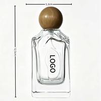 Atomiseur de parfum élégant de qualité supérieure 100 ml avec capuchon sphérique en bois naturel, corps en verre, échantillon gratuit, emballé en carton pour usage domestique quotidien