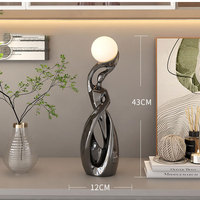 Figurine en résine sculptée d'art abstrait moderne avec forme irrégulière pour la décoration de la maison, veilleuse
