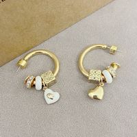 Nouvelles boucles d'oreilles élégantes et tendance, design de niche de luxe léger, pendentif cube en forme de cœur orné de strass, émail glacé