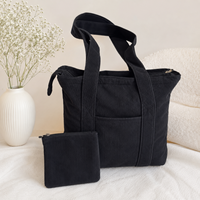 2026 Schwarze Cord-Tragetasche mit Reißverschluss und Vordertasche Weiche Wiederverwendbare Schultertasche für Arbeit Reisen Einkaufen Individuelles Logo Großhandel