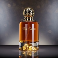 Flacon de parfum de luxe en verre transparent de 100 ml avec base en forme de montagne dorée et bouchon texturé pour emballage de marque