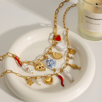Collier Océanique Mirawell Tendance en Acier Inoxydable Plaqué Or PVD 18K avec Breloques en Céramique Corail, Étoile de Mer, Conque, Escargot, Poisson et Coquillage Perlé