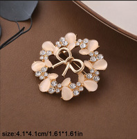 Broche de mode pour femme, ornée de strass effet diamant et de pierres œil de chat en forme de fleur, pour corsage et revers, accessoires vestimentaires