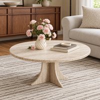 MEUBLES JIAMEIJIA |   Table basse ronde effet travertin avec piétement sculpté en forme de croix
