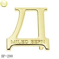 Fabricant de boucles de ceinture tendance, boucle personnalisée en lettres dorées, ceinture réglable, accessoire métallique, forme ronde, logo métallique, quincaillerie pour la taille