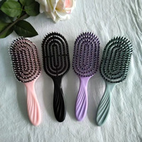 2023 boucle personnalisée démêlant brosse à cheveux moderne 12 pagaie peigne forme ovale poils de sanglier rembourré Compact bouclés pagaie Logo personnalisé