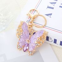 Collection de luxe exquise : Pendentif double usage en émail, broche papillon et porte-clés, idéal pour manteaux, sacs et autres.