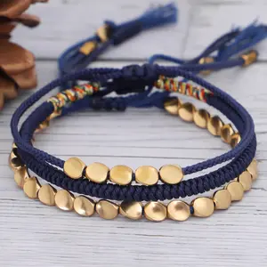 Cuentas de cobre chapadas en oro hechas a mano, borla ajustable tejida a mano, cuerda de nailon trenzada azul de la suerte, pulsera de hilo