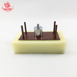 A small table with sponge blocks is used in a middle school <b>physics</b> experiment to demonstrate the relationship between the - Product Image 3
