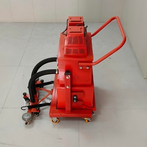 Système d'aspiration industriel manuel à double tête avec engrenage et moteur pour le nettoyage des surfaces en béton - Product Image 1