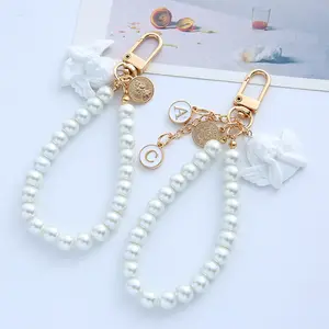 Factory Direct Price Aesthetic Angel Keychain With Pearl Bead Wrist Baroque Airpods Pendant Bag Keychains For Women Girl