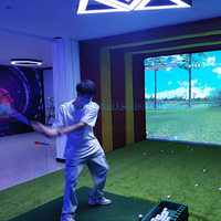 Véritable simulateur de golf Trackman interactif avec projection intelligente Nouveau design de boîtier de golf intérieur pour centre commercial