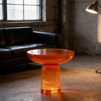 Table basse en résine époxy orange vif, design disque à bord large, pour espaces contemporains