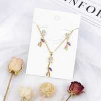 Ensembles de bijoux en cuivre plaqué or 18 carats avec pendentif feuille en zircone bleu ciel et boucles d'oreilles pendantes, vente en gros