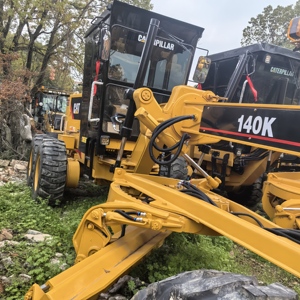 รถเกรดเดอร์ Caterpillar 140K มือสอง อุปกรณ์หนักสีเหลือง เครื่องจักรก่อสร้าง - Product Image 1