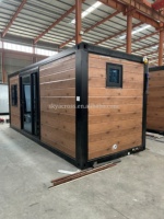 Skyacross2602 Changxu Maisonnette Préfabriquée Mobile Autonome Verte en Bois, Maison Modulaire Portable de Type Conteneur 20 Pieds