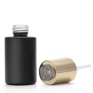 Lujo vacío redondo plano 20ml 30ml buen <span class=keywords><strong>precio</strong></span> negro vidrio esmerilado espiral boca cosmético suero esencia cuentagotas botella tapas <span class=keywords><strong>de</strong></span> botón - Product Image 1