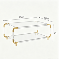 Table basse décorative de luxe à deux niveaux en verre trempé transparent avec cadre en acier inoxydable argenté et pieds en acrylique pour salon