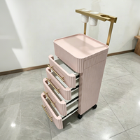 Chariot de rangement mobile pour outils de coiffure au design côtelé moderne avec support pour sèche-cheveux