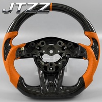 Volant personnalisé en carbone pour Mazda 6 CX-3 avec poignée en cuir orange et finition en fibre de carbone noire