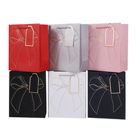 Sac en papier texturé blanc en promotion avec votre logo personnalisé pour mariage et vêtements