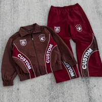 Ensemble de survêtement homme color block avec veste zippée et pantalon de survêtement, panneaux contrastants, tenue de sport streetwear, survêtements personnalisés en gros