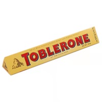 Tobleron Triangle suisse Chocolat noir Chocolat au lait aux raisins secs Chocolat blanc 100g