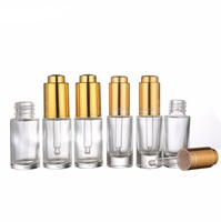 Flacon compte-gouttes en verre dépoli transparent de 30 ml (1 oz) avec bouton poussoir doré ou argenté pour sérum et huiles essentielles cosmétiques