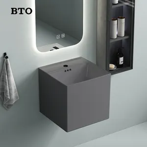 BTO競争力のある価格固体表面壁掛けセラミック洗面器壁掛けスタイルダークグレー容器シンク穴付き